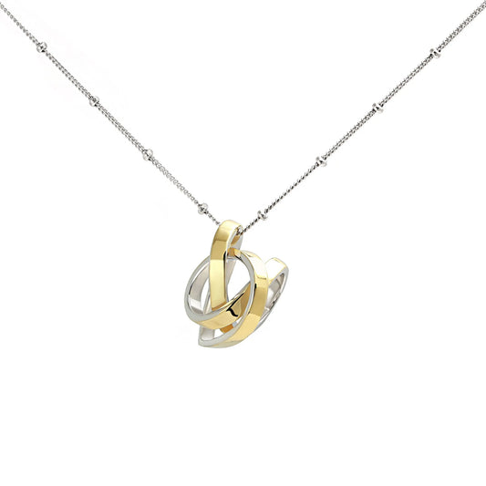 Yvette Ries Herz-Anhänger Silber bicolor mit vergoldeten Akzenten an filigraner Kette. Eleganter Schmuck bei Bendixen-Braun, ideal als Geschenk.