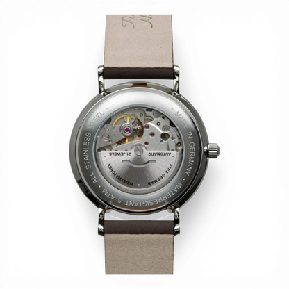 Bendixen-Braun Bauhaus automatic men's watch with stainless steel case, leather strap, and exhibition case back showing the movement.