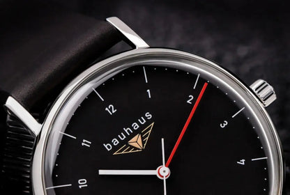 Bendixen-Braun Bauhaus men's watch with black dial, stainless steel case, and red second hand.