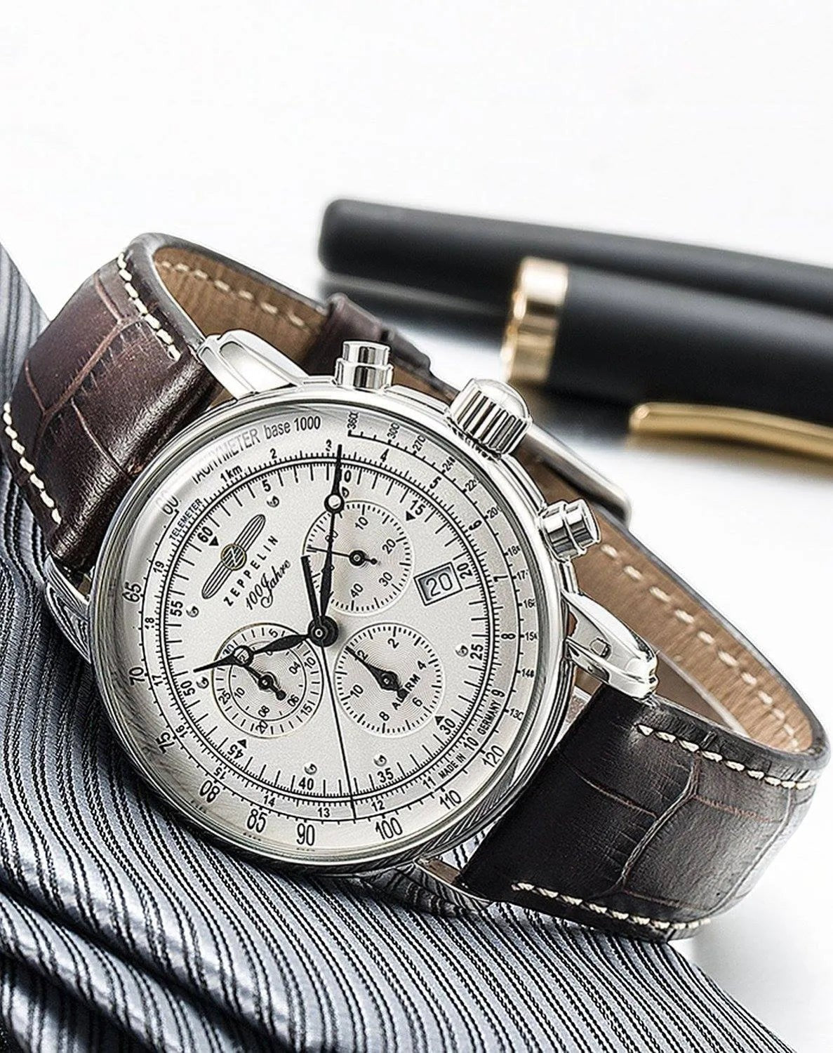 Bendixen-Braun men's silver dial chronograph watch with alarm, stainless steel case, and brown leather strap.