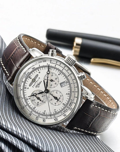 Bendixen-Braun men's silver dial chronograph watch with alarm, stainless steel case, and brown leather strap.