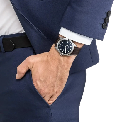 Bendixen-Braun men's solar-powered watch with dark blue dial, silver case, and brown embossed leather strap.