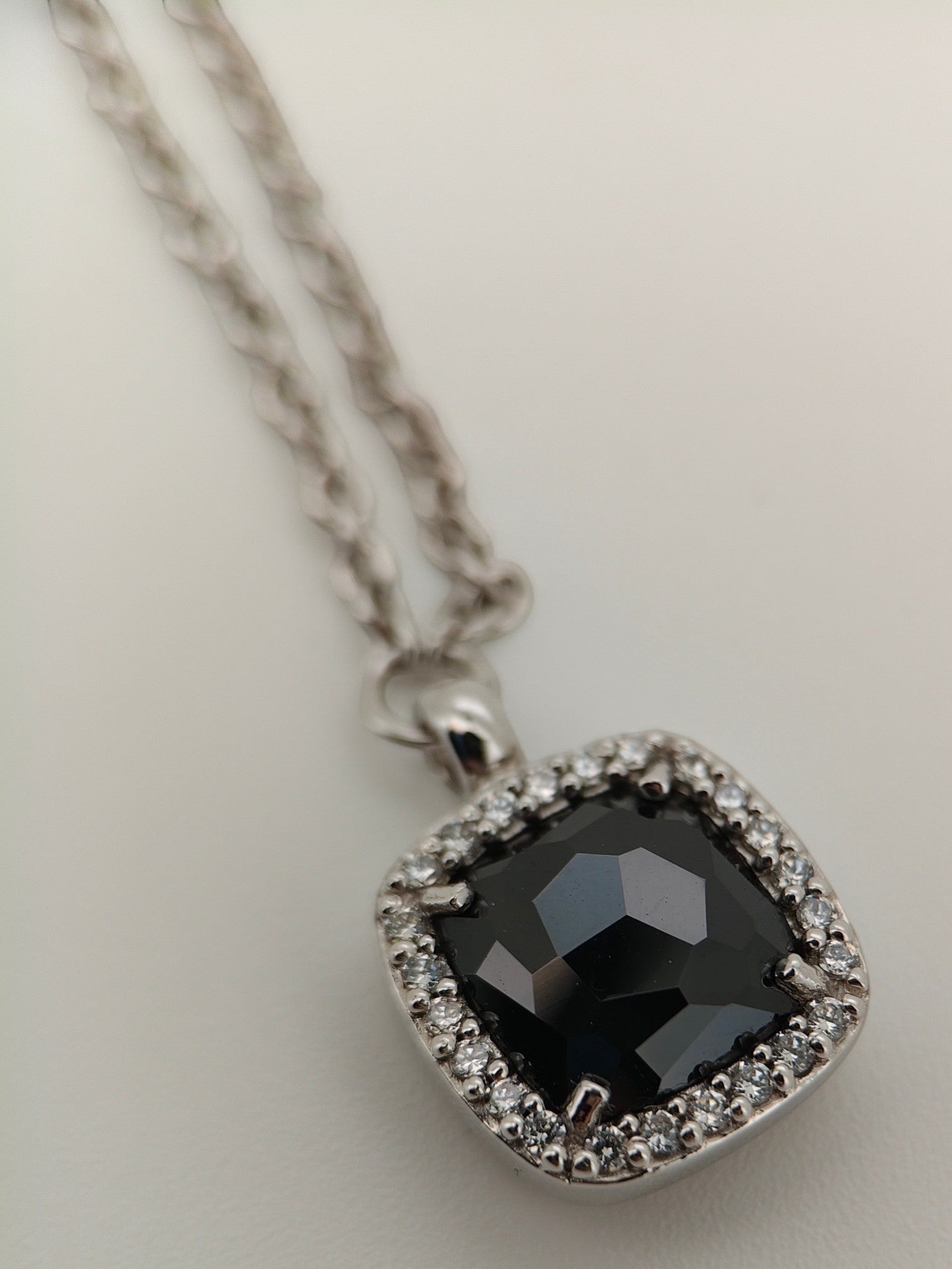 Bendixen-Braun rhodium-plated 925 sterling silver necklace with square black faceted pendant surrounded by cubic zirconia.