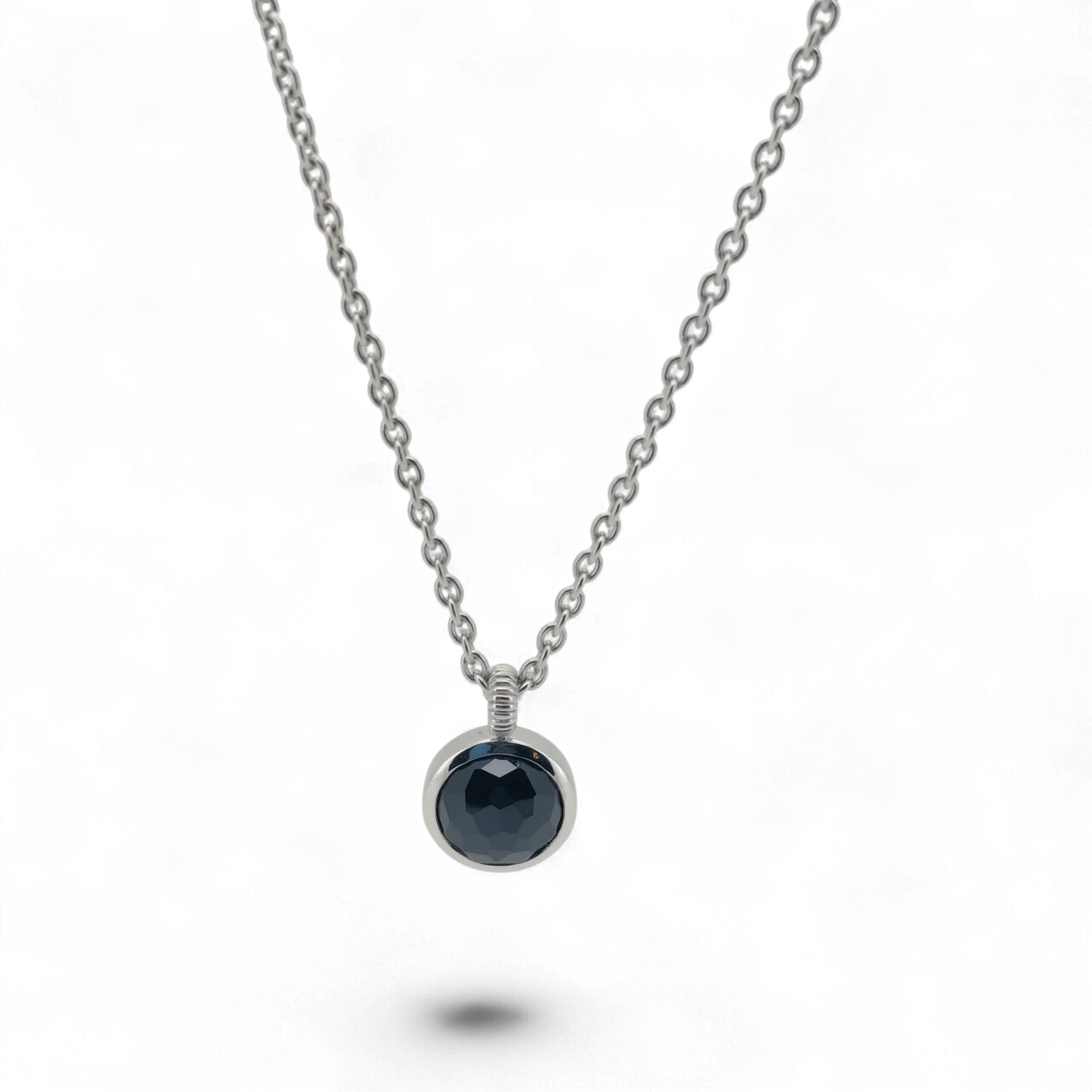 Bendixen-Braun silver necklace with rhodium finish and a round, faceted black stone pendant. Adjustable chain.