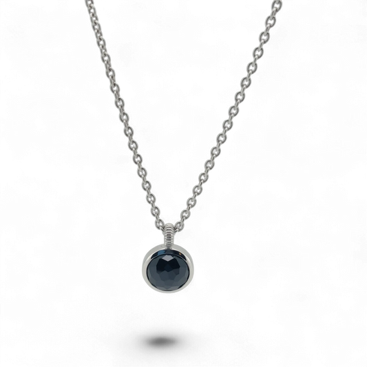Bendixen-Braun silver necklace with rhodium finish and a round, faceted black stone pendant. Adjustable chain.