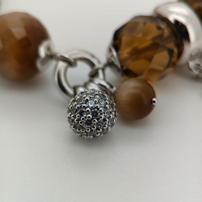 Bendixen-Braun rhodium-plated silver bracelet with brown glass stones and sparkling zirconia details.